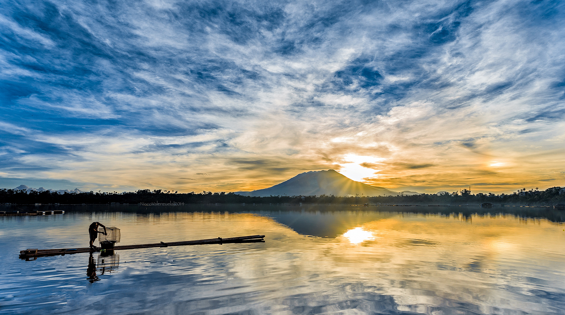 A fisherman at sunrise at Sampaloc Lake, Laguna Philippines (2014)