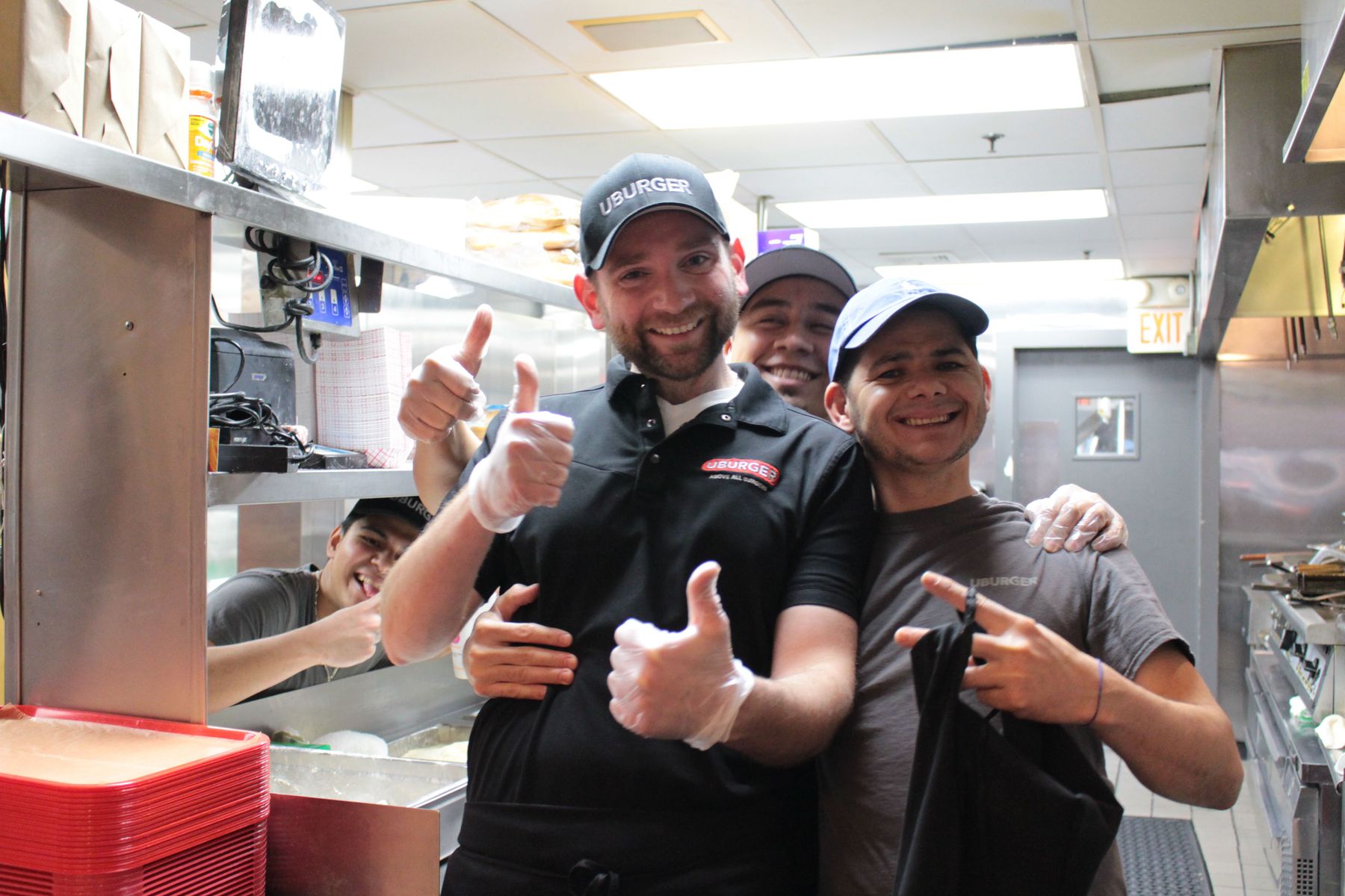 Gustavo (left), Andrew (center), Hector (back), and DD (right), gladly pose for an impromptu photo in a rare down moment between customers. (Megan has worked with them for three years now.)
