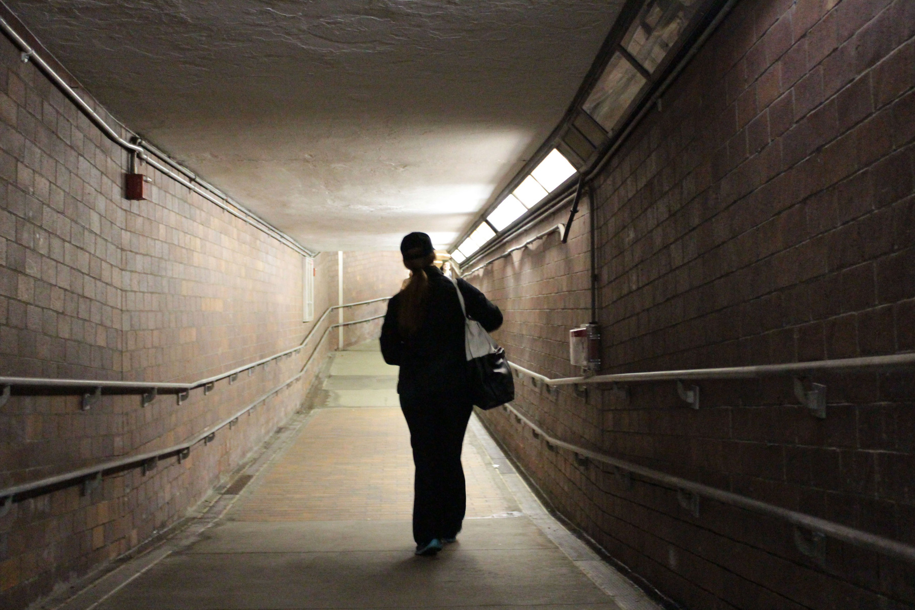 At the end of her double shift, Megan walks toward the outbound T at Kenmore. She moves briskly despite over 14 hours on her feet. 
