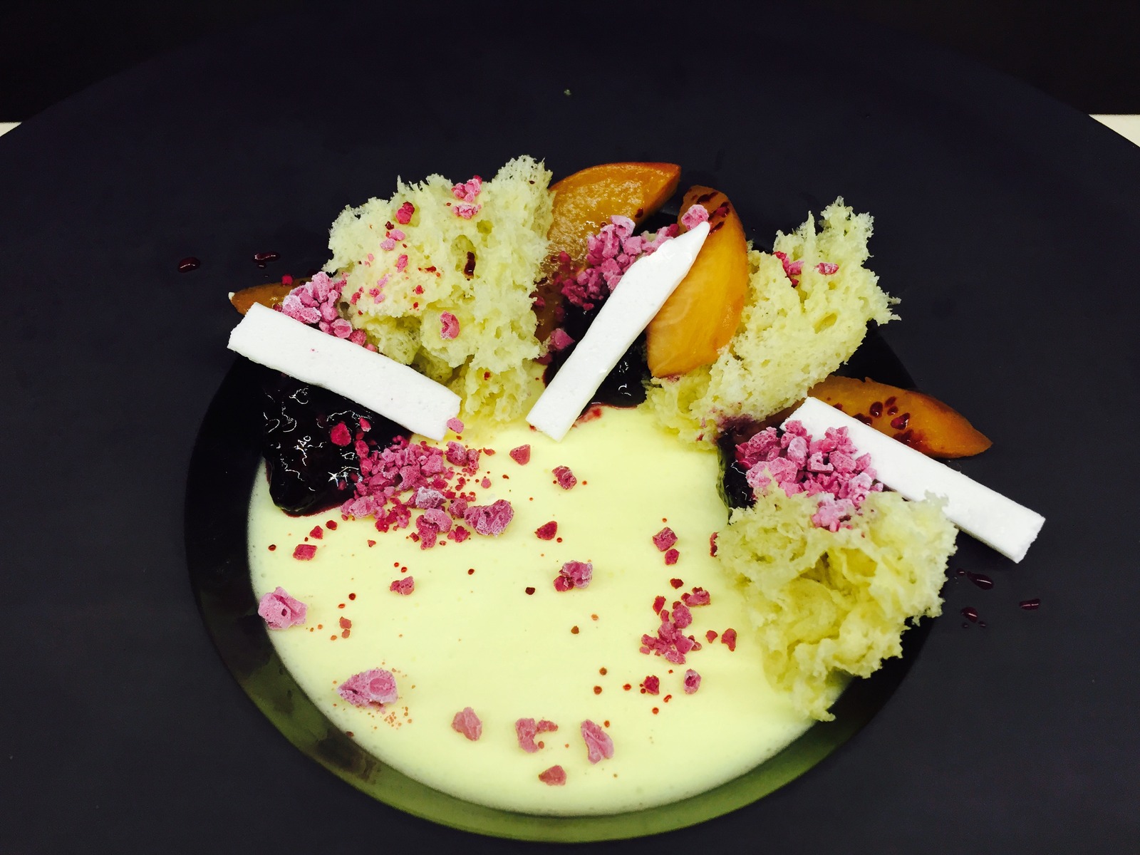 Saffron Mousse, wine poached peaches, macerated blueberries, olive oil cake