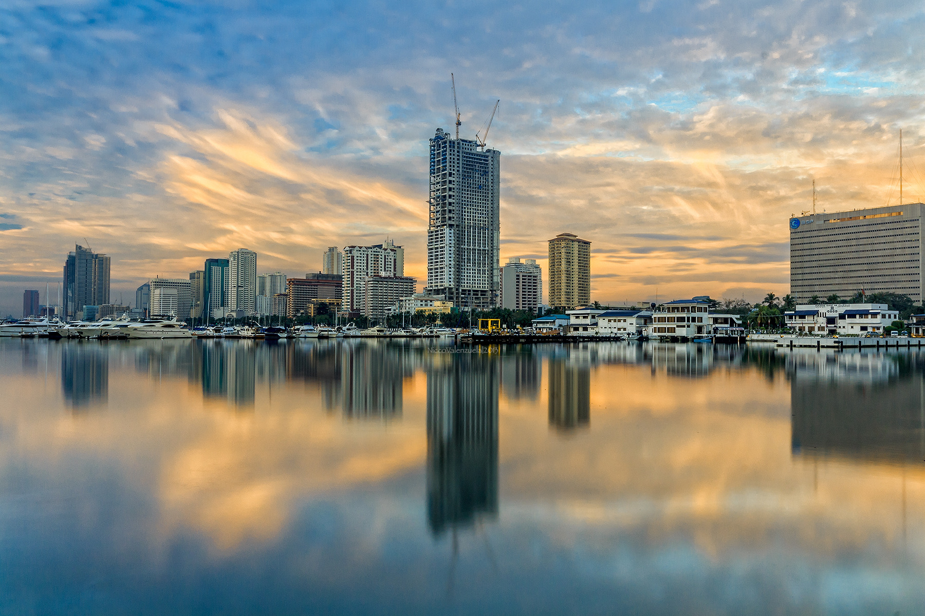 The infamous Manila Bay sunset reflecting against the cityscape of Manila. (Manila, 2013) 