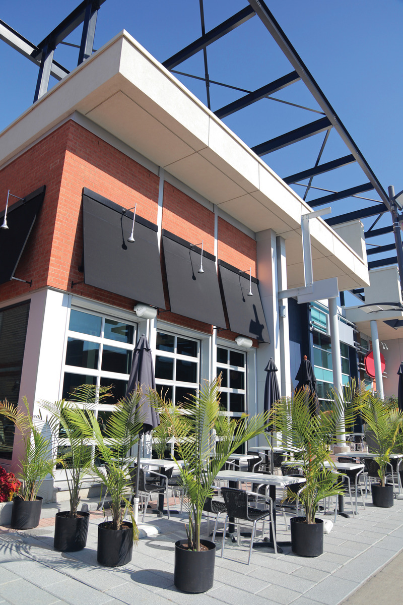 Photoshopped the white outdoor speakers into the scene.